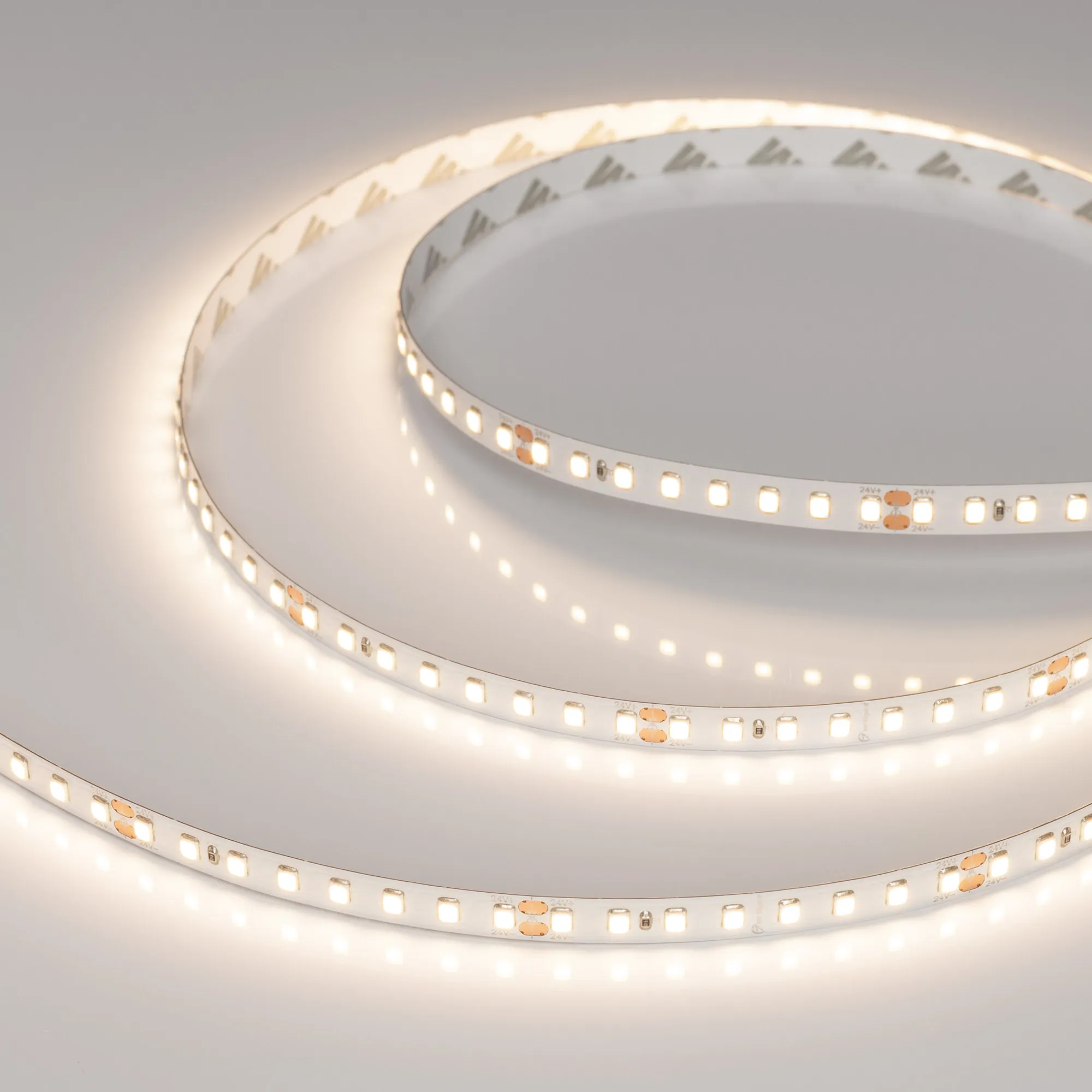 Лента светодиодная RT-A128-8mm 24V Warm3500 (9.6 W/m, IP20, 2835, 5m) (Arlight, высок.эфф.150 лм/Вт) - изображение товара